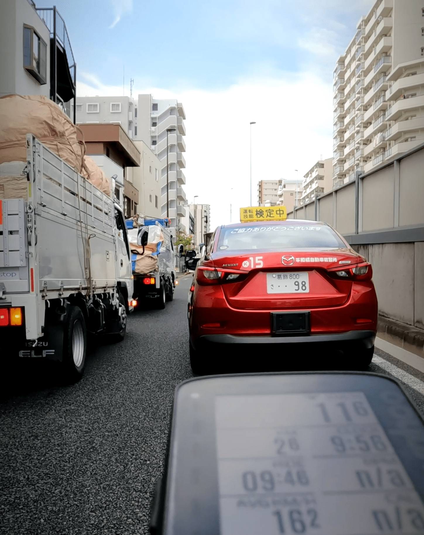 White line. Engines. Stoplights. Trucks brushing past.