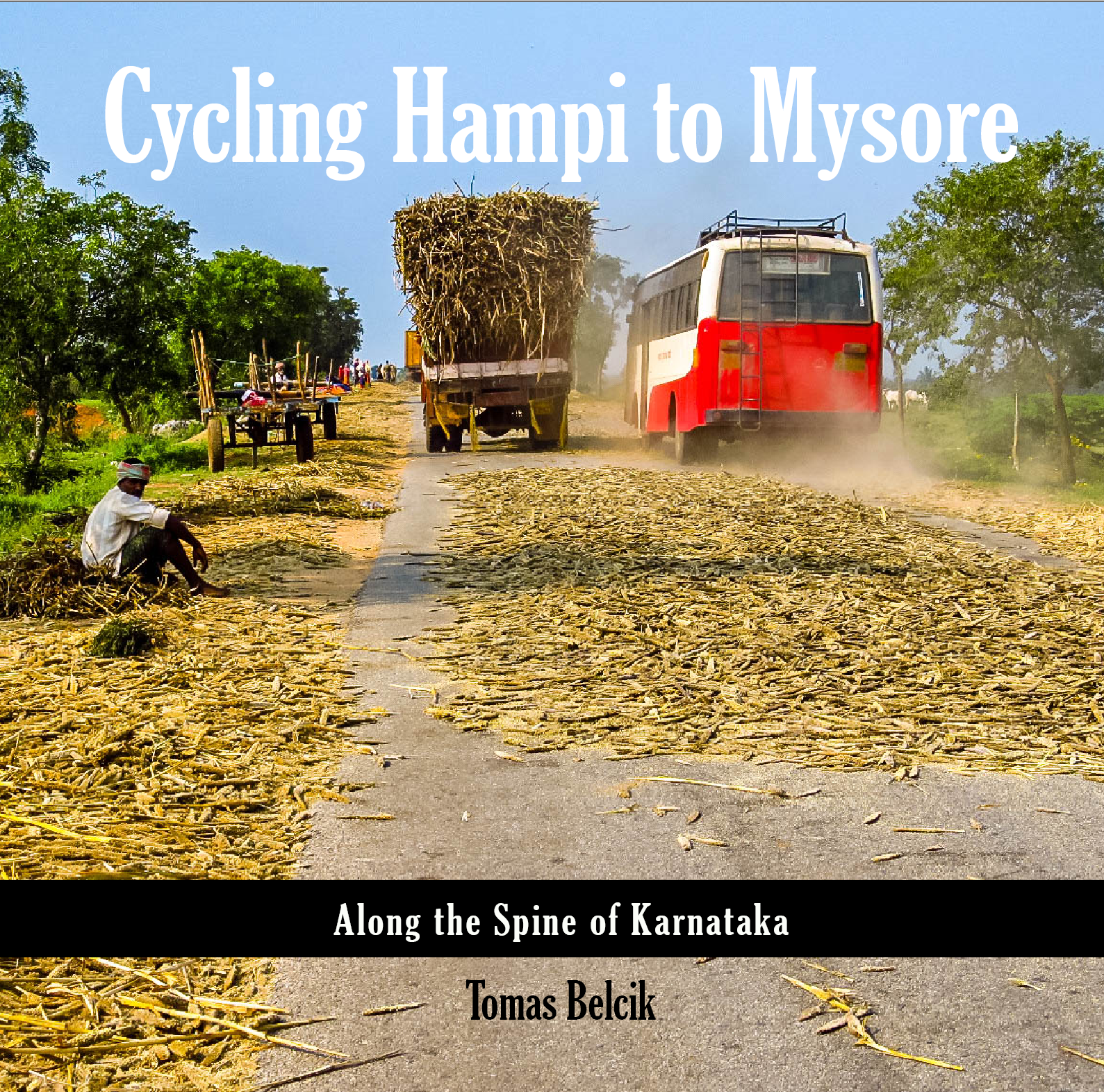 A husk-covered road, a bus blasting past in dust, farmers watching